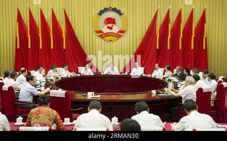 (140717) -- BEIJING, July 17, 2014 (Xinhua) -- Yu Zhengsheng (C, rear), chairman of the National Committee of the Chinese People s Political Consultative Conference (CPPCC), presides over the 18th meeting of the chairman and vice-chairpersons of the 12th CPPCC National Committee in Beijing, capital of China, July 17, 2014. (Xinhua/Huang Jingwen) (zkr) CHINA-BEIJING-CPPCC-YU ZHENGSHENG-MEETING (CN) PUBLICATIONxNOTxINxCHN   Beijing July 17 2014 XINHUA Yu Zheng Sheng C Rear Chairman of The National Committee of The Chinese Celebrities S Political Consultative Conference CPPCC Presid Over The 18th Stock Photo