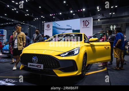 Bangkok, Bangkok, Thailand. 27th Aug, 2023. August 27, 2023, Visitors inspect a MG5 car during the Thailand Big Motor Sale 2023 at Bangkok International Trade and Exhibition Center (Credit Image: © Wissarut Weerasopon/ZUMA Press Wire) EDITORIAL USAGE ONLY! Not for Commercial USAGE! Stock Photo