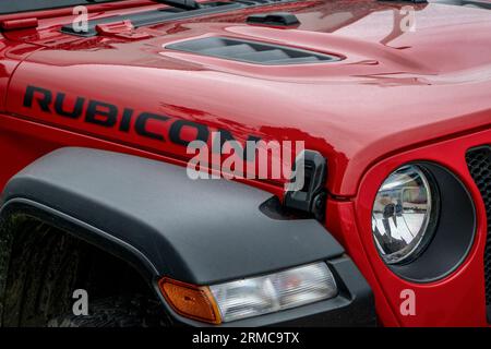 Loveland, CO, USA - August 25, 2023: Detail of red Jeep Wrangler with Rubicon logo on a hood. Stock Photo