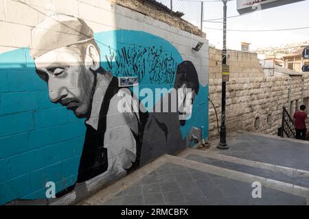 Ein Wandgemälde in Amman - Renovierungsprojekt an der Al-Kalha-Treppe in der Innenstadt von Amman. Künstler Ziad Rahbani, faraj suleiman, Froggie Lee Stockfoto