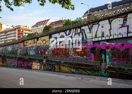 Vienna, Austria - June 13, 2023: View of graffiti on the Danube Canal embankment in Vienna Stock Photo