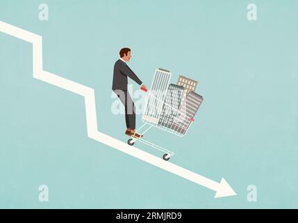 Geschäftsmann Investor mit Einkaufswagen mit Gebäuden, die nach unten abwärts gleiten Pfeil Stockfoto