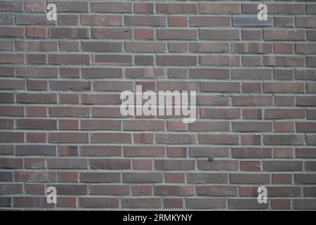 Rotbraune Ziegelwand. Vorlage für Hintergrund und Textur. Stockfoto
