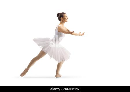 Profilaufnahme einer Ballerina in einem weißen Tutu-Kleid, die isoliert auf weißem Hintergrund tanzt Stockfoto