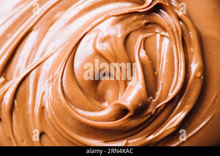 Geschmolzene Schokolade wirbeln Hintergrund Stockfoto
