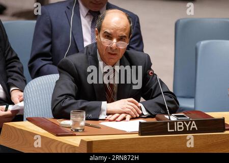 POLITIK Sitzung des UN-Sicherheitsrats (151009) -- NEW YORK, 9. Oktober 2015 -- der libysche Botschafter bei den Vereinten Nationen Ibrahim Dabbashi spricht, nachdem der UN-Sicherheitsrat am 9. Oktober 2015 im UN-Hauptquartier in New York eine Resolution zur Unterbindung des Menschenhandels und der Schleusung von Migranten auf hoher See vor der Küste Libyens verabschiedet hat. Der UN-Sicherheitsrat hat am Freitag eine Resolution verabschiedet, die darauf abzielt, den Menschenhandel und die Schleusung von Migranten auf hoher See im Mittelmeer vor der Küste Libyens zu unterbinden. ) UN-NEW YORK-SICHERHEITSRAT-MITTELMEER-MENSCHENHANDEL L Stockfoto