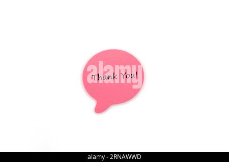 Pink Post it Note Speech Bubble with Hand written Thank you Text Stockfoto