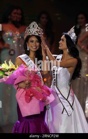 (160418) -- QUEZON CITY, 18. April 2016 -- Binibining Pilipinas (Miss Philippines) 2015 und die amtierende Miss Universe 2015 Pia Alonzo Wurtzbach (R) krönt Maxine Medina während der Krönungsnacht in Quezon City, den Philippinen, am 18. April 2016 zur Miss Philippines-Universe 2016. Das Binibining Pilipinas Pageant krönte am frühen Montag seine neuesten Schönheitsköniginnen, die das Land bei internationalen Schönheitswettbewerben vertreten werden. ) PHILIPPINEN-QUEZON CITY-BINIBINING PILIPINAS 2016-KRÖNUNGSNACHT RouellexUmali PUBLICATIONxNOTxINxCHN 160418 Quezon City 18. April 2016 Binibining Pilipinas Miss P Stockfoto