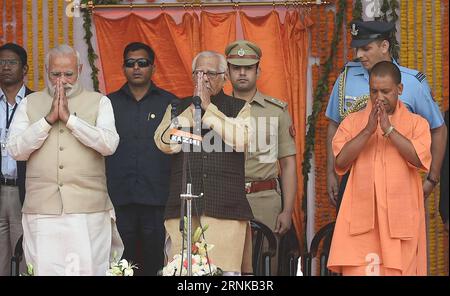 (170319) -- LUCKNOW (INDIEN), 19. März 2017 -- der indische Premierminister Narendra Modi (Front L), Gouverneur von Uttar Pradesh RAM Naik (Front C) und neu ernannter Ministerpräsident von Uttar Pradesh Yogi Adityanath (Front R) begrüßen die Menge während der Vereidigung von Yogi Adityanath in Lucknow, Hauptstadt des nordindischen Bundesstaates Uttar Pradesh am 19. März 2017 wurde Yogi Adityanath, ein umstrittener Hindu-heiliger und fünfmaliger Parlamentarier der regierenden Bharatiya Janata Party (BJP), am Sonntag als Premierminister von Indiens bevölkerungsreichstem und politisch bedeutsamstem Bundesstaat Utta vereidigt Stockfoto