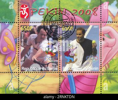 BENIN - CA. 2007: Briefmarke von Benin, zeigt Pete Sampras, Disney Caharacter und Olympic Rings, ca. 2007 Stockfoto