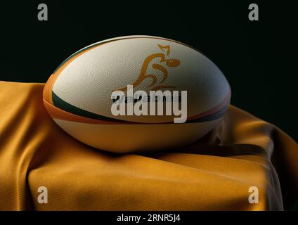 2. September 2023 - Bristol, Großbritannien: Ein 3D-Bild eines Rugby-Balls mit dem australischen Rugby-Logo auf einem drapierten gelben Stoff Stockfoto