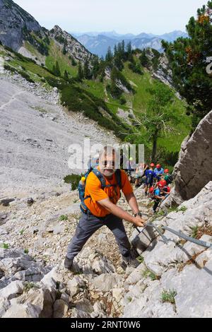 Kletterer auf dem Widauersteig Klettersteig bei Scheffauer, Wilder Kaiser, Kufstein, Tirol, Österreich Stockfoto