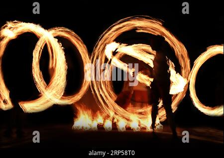 Motion Blur Long Exposure Photography Of Fire Ball Dancers At Kandy Esala Procession In Kandy, Sri Lanka. Stockfoto