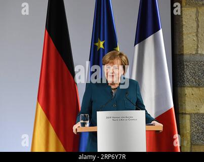 (190122) -- AACHEN, 22. Januar 2019 (Xinhua) -- Bundeskanzlerin Angela Merkel hält eine Rede anlässlich der Unterzeichnung des Aachener vertrags am 22. Januar 2019 in Aachen. Bundeskanzlerin Angela Merkel und der französische Präsident Emmanuel Macron haben am Dienstag einen Vertrag zur Erneuerung der Freundschaft und Zusammenarbeit zwischen den beiden Ländern unterzeichnet. Der sogenannte Aachener vertrag, der von Merkel und Macron unterzeichnet wurde, strebt eine engere Zusammenarbeit zwischen Deutschland und Frankreich in der Wirtschafts-, Verteidigungs- und Europapolitik an. Der Aachener vertrag steht im Einklang mit dem 1963 unterzeichneten Elysee-vertrag. (Xinhua/Lu Yang) DEUTSCHLAND-AACHEN Stockfoto