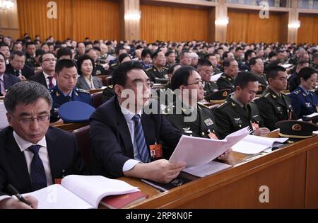 (190312) -- PEKING, 12. März 2019 -- die Abgeordneten des 13. Nationalen Volkskongresses (NPC) nehmen an der dritten Plenarsitzung der zweiten Sitzung des 13. NPC in der Großen Halle des Volkes in Peking, Hauptstadt von China, am 12. März 2019 Teil. ) (ZWEI SITZUNGEN)CHINA-PEKING-NPC-DRITTE PLENARSITZUNG (CN) YANXYAN PUBLICATIONXNOTXINXCHN Stockfoto