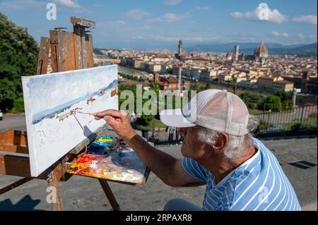Ein Florentiner Künstler, Ölgemälde einer Skyline-Szene von Florenz von Piazzale Michelangelo in der Toskana in Italien. Stockfoto