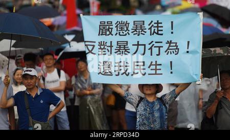 (190720) -- HONG KONG, 20. Juli 2019 -- Menschen nehmen an einer massiven Kundgebung im Tamar Park im südchinesischen Hong Kong Teil, 20. Juli 2019. Mehr als 300.000 Menschen nahmen am Samstag an der Massenversammlung von Safeguard Hong Kong Teil, um die Rechtsstaatlichkeit zu unterstützen und sich gegen die Anwendung von Gewalt zu wenden. ) CHINA-HONG KONG-RALLY (CN) WangxShen PUBLICATIONxNOTxINxCHN Stockfoto