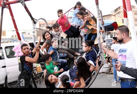 (190814) -- DAMASKUS, 14. August 2019 -- Kinder genießen ihre Zeit während des viertägigen Urlaubs des Eid al-Adha in Damaskus, Syrien, 13. August 2019. (Foto: /Xinhua) SYRIA-DAMASCUS-EID AL-ADHA-HOLIDAY AmmarxSafarjalani PUBLICATIONxNOTxINxCHN Stockfoto