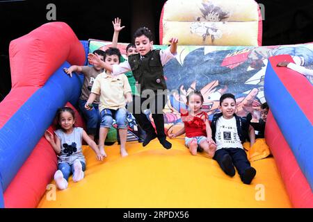 (190814) -- DAMASKUS, 14. August 2019 -- Kinder genießen ihre Zeit während des viertägigen Urlaubs des Eid al-Adha in Damaskus, Syrien, 13. August 2019. (Foto: /Xinhua) SYRIA-DAMASCUS-EID AL-ADHA-HOLIDAY AmmarxSafarjalani PUBLICATIONxNOTxINxCHN Stockfoto