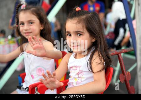 (190814) -- DAMASKUS, 14. August 2019 -- Kinder genießen ihre Zeit während des viertägigen Urlaubs des Eid al-Adha in Damaskus, Syrien, 13. August 2019. (Foto: /Xinhua) SYRIA-DAMASCUS-EID AL-ADHA-HOLIDAY AmmarxSafarjalani PUBLICATIONxNOTxINxCHN Stockfoto