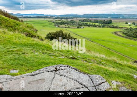 Footprint in Rock, Dunadd Hill Fort, Kilmartin Glen, Argyll, Schottland, UK Stockfoto