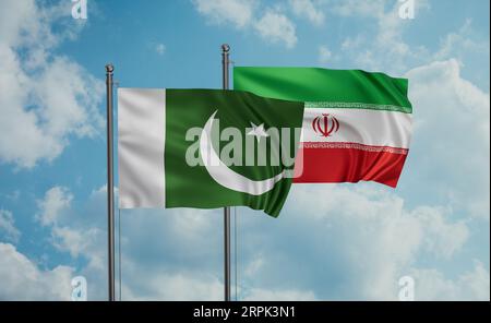 Die iranische Flagge und die pakistanische Flagge wehen am blauen Himmel zusammen Stockfoto