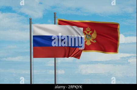 Montenegro und Russland wehen im Wind am blauen Himmel zusammen, zwei Länderkooperationskonzept Stockfoto