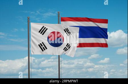 Die Flagge des Königreichs Thailand und Südkoreas, die im Wind am blauen Himmel zusammenwinkt, zwei Länderkooperationskonzept Stockfoto