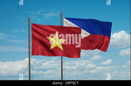 Die Flagge der Philippinen und Vietnams weht im Wind am blauen Himmel zusammen, zwei Konzepte der Länderzusammenarbeit Stockfoto
