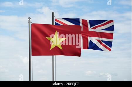 Flagge des Vereinigten Königreichs und Vietnams, die im Wind am blauen Himmel zusammenwinken, Konzept der Zusammenarbeit zwischen zwei Ländern Stockfoto