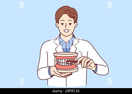 Der Zahnarzt erklärt die Regeln des Zähneputzens, das Halten der Zahnbürste und des Riesenkiefers in den Händen. Guy Zahnarzt empfiehlt die Einhaltung der Hygienevorschriften, um das Auftreten von Karies im Mund zu vermeiden Stock Vektor