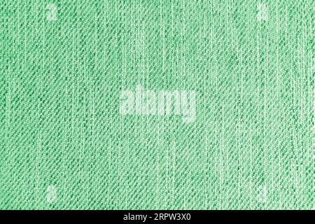 Jacquard-Polsterung, grüne grobe Gewebestruktur. Textilhintergrund, Möbeltextilien, Tapete, Hintergrund. Stoffstruktur im Nahbereich. Stockfoto