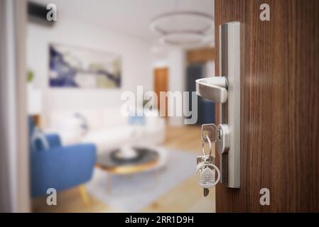 Kaufen Sie ein neues Home-Konzept. Schlüsselring mit Schlüsseln im Türschloss Stockfoto
