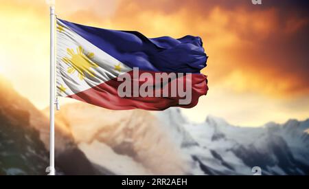 Flagge der Philippinen auf einem Fahnenmast vor einem bunten Himmel Stockfoto