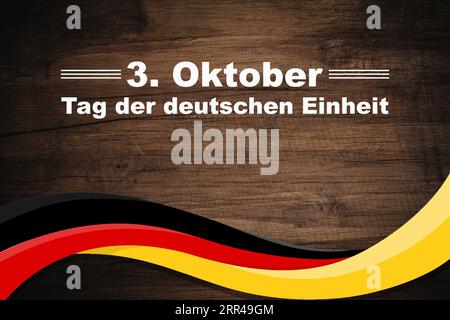 Deutschland Tag der Einheit 3. Oktober. Text auf einer Webflagge Deutschlands. Tag der Deutschen Einheit. Stockfoto