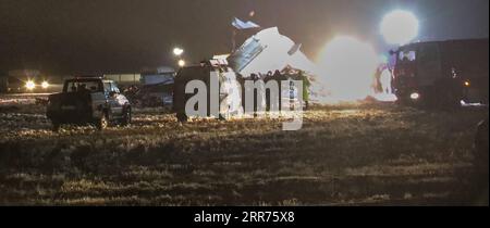 210314 -- NUR-SULTAN, 14. März 2021 -- nach einem Absturz eines Militärflugzeuges auf dem Almaty International Airport in Almaty, Kasachstan, am 13. März 2021, sind die Arbeiten im Gange. Vier Menschen wurden getötet und zwei weitere wurden beim Absturz eines militärischen Transportflugzeugs der an-26 am Flughafen in der südkasachischen Stadt Almaty am Samstag verletzt, so die Behörden. Foto von /Xinhua SPOT NEWSKAZAKHSTAN-ALMATY-FLUGZEUGABSTURZ KalizhanxOspanov PUBLICATIONxNOTxINxCHN Stockfoto