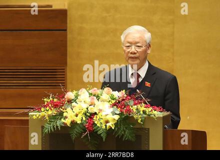 210324 -- HANOI, 24. März 2021 -- Generalsekretär des Zentralkomitees der Kommunistischen Partei Vietnams CPVCC und vietnamesischer Präsident Nguyen Phu Trong halten einen Bericht auf der Eröffnungssitzung der 11. Sitzung der 14. Nationalversammlung Vietnams in Hanoi, Vietnam, 24. März 2021. Die 14. NA von Vietnam, die oberste Legislative des Landes, eröffnete am Mittwoch ihre 11. Sitzung, die letzte in ihrer Amtszeit, in der vietnamesischen Hauptstadt Hanoi, mit wichtigen Personalveränderungen in Sicht. Via Xinhua VIETNAM-HANOI-NATIONAL ASSEMBLY-SESSION VNA PUBLICATIONxNOTxINxCHN Stockfoto