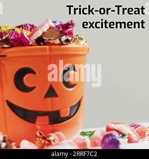 Komposition aus Trick or Treat Experience Text und halloween Kürbis mit Süßigkeiten auf weißem Hintergrund Stockfoto