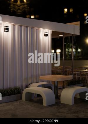 Ein Sitzplatz im Freien in der Nähe eines modernen, minimalistischen Coffee Shops in der Nacht. Ein modernes Straßencafé oder Restaurant in der Stadt. 3D-Rendering, 3D-Abbildung Stockfoto