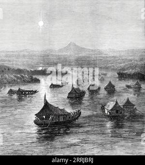 The Expedition Against the Malays: The British Force ascending the Perak River, 1876. Episode aus dem Perak-Krieg: "...die gemeinsamen Militär- und Marinestreitkräfte unter dem Kommando von Generalmajor Colborne, C.B., und Kapitän Alexander Buller, R.N., die den Perak-Fluss auf der malaiischen Halbinsel erklimmen, um die Mörder des verstorbenen Mr. Birch zu bestrafen, den Briten, der unter den malaiischen Stämmen dieser Region ansässig ist...[View] Neben oberhalb von Passir Telor. Sie zeigt die Flottille von 45 Booten, die die Kraft auf ihrem Weg den Fluss hinauf transportieren. Die großen quadratischen Boote sind diejenigen, die Waffen, Proviant und Kohlen transportieren Stockfoto