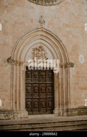 Door at church of San Francesco d’Assisi in Ostuni, Italy Stock Photo