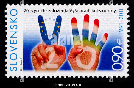 Briefmarke zum 20. Geburtstag der Stiftung der Visegrad (V4)-Gruppe. Briefmarke, die 2011 in der Slowakei ausgestellt wurde. Die Visegrád-Gruppe (auch bekannt als Visegrád Four, V4 oder Europäisches Quartett) ist ein kulturelles und politisches Bündnis der vier mitteleuropäischen Länder: Tschechien, Ungarn, Polen und die Slowakei. Stockfoto