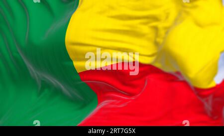 Nahaufnahme des Wehens der Nationalflagge von Benin. Zwei horizontale gelbe und rote Bänder auf der Fliegenseite und ein grünes vertikales Band an der Hebevorrichtung. 3D-Abbildung zu Stockfoto