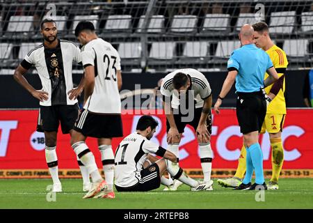 Dortmund, Deutschland. September 2023. Fußball: International, Deutschland - Frankreich, Signal Iduna Park. Ilkay Gündogan wird auf dem Spielfeld verletzt. Quelle: David Inderlied/dpa/Alamy Live News Stockfoto