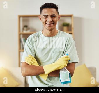 Reiniger, Mann im Porträt und Chemikalie mit überkreuzten Armen, glücklich und hygienisch mit Housekeeping, Waschmittel und Handschuhen. Hausmeister, Reinigungslösung in Stockfoto