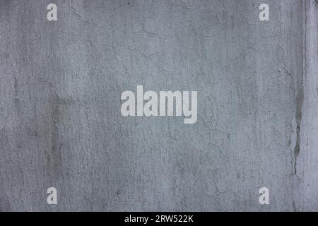 Außenwand aus Beton mit mattgrauer Farbe und Flecken - Hintergrund mit Vollrahmen und flacher Textur. Stockfoto