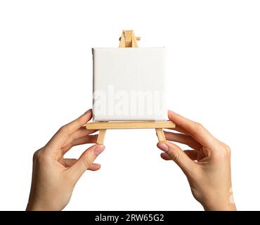 Leeres weißes Leinwandmodell auf hölzerner Staffelei, isoliert auf weiß Stockfoto