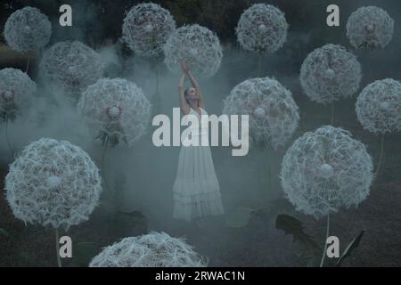 Wunderschöne Ballerina mit riesigen Löwenzahn-Blüten Stockfoto