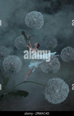 Wunderschöne Ballerina mit riesigen Löwenzahn-Blüten Stockfoto