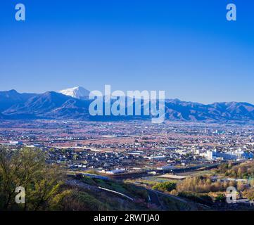 Yamanashi Prefecture Landscapes Peach blossoms in the city of Yamanashi and Mt. Fuji in the distance The unnamed observatory Stock Photo